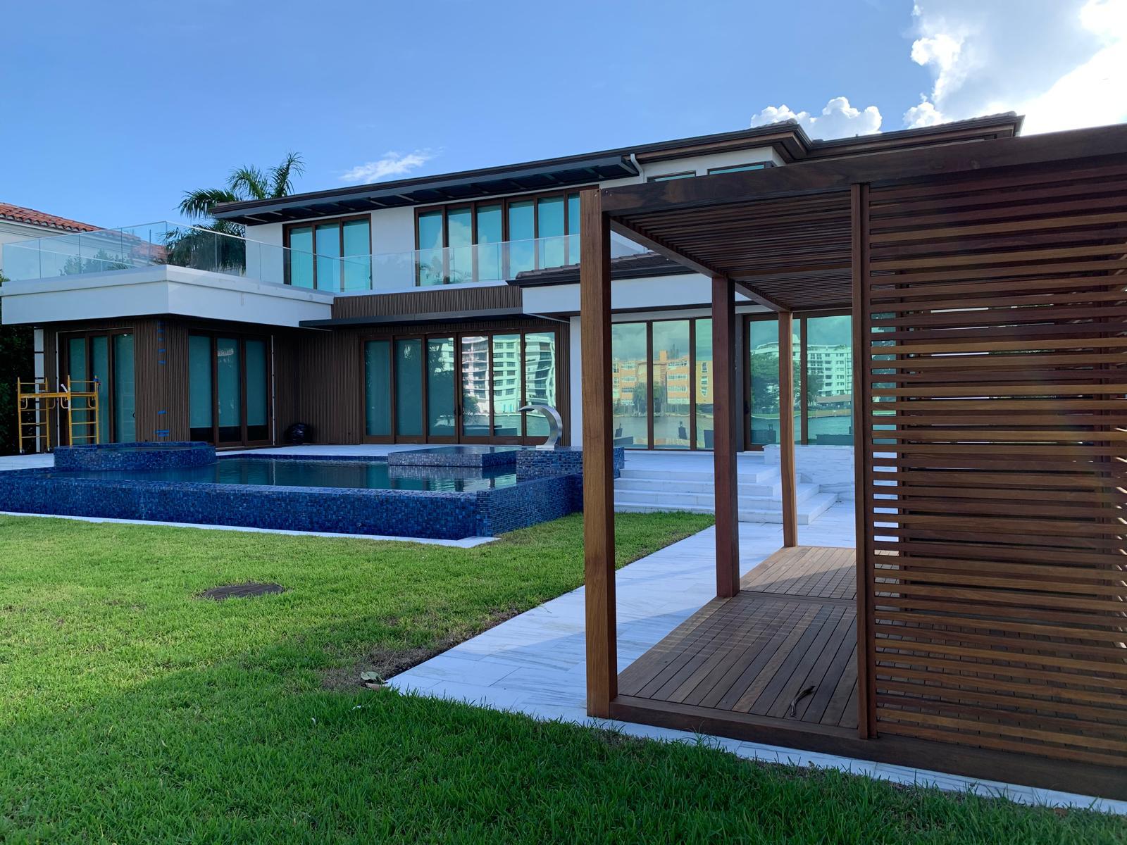Luxury outdoor living area and patio in Miami custom home by OD Construction Group Corp